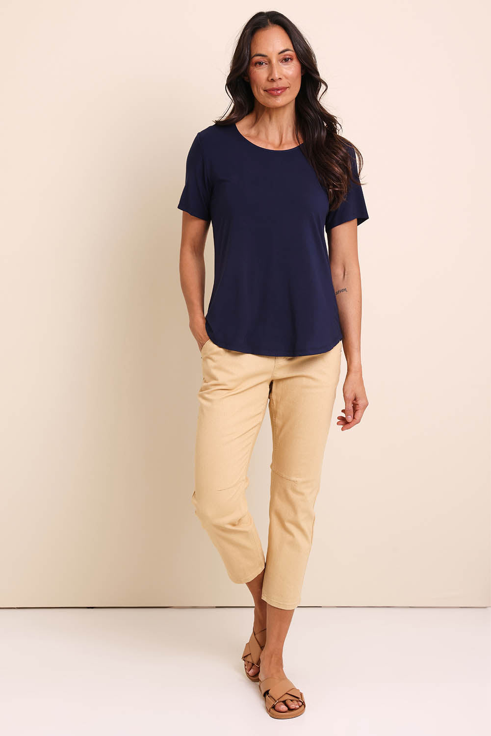 Model Amandam wearing size 10 of the The Pull On Cotton Pant With Drawstring – Sand in colour Sand, from the front