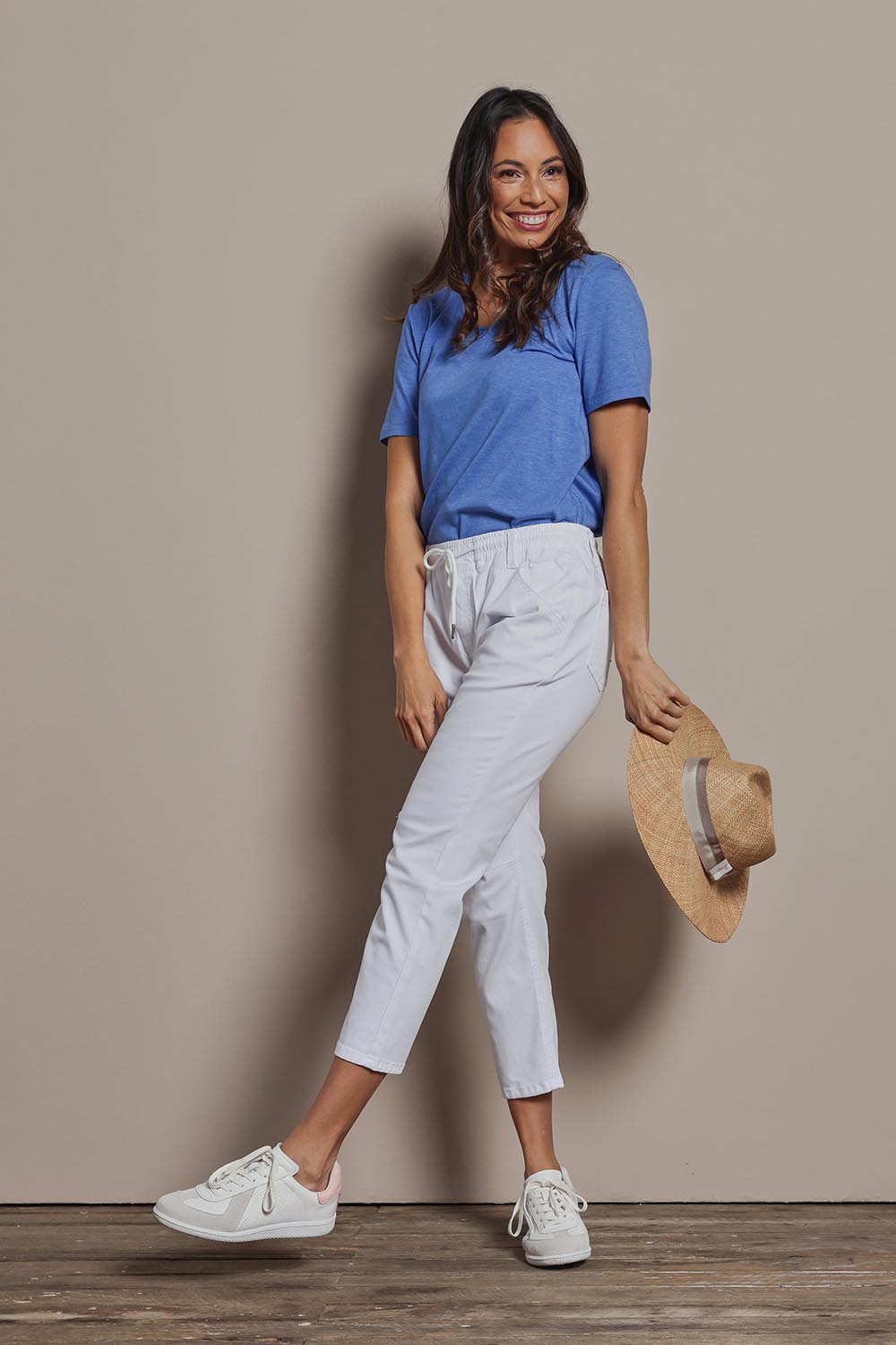 Model Amanda wearing size 10 of The Pull On Cotton Pant With Drawstring in colour White (White), from the front, showing the whole outfit