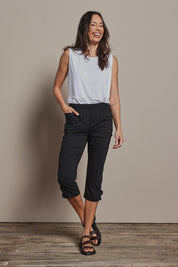Model Amanda wearing size 10 of The Pull On Elastic Waist Cotton Blend Capri Pant in colour Black (Black), from the front, showing the whole outfit