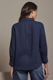 Model Madeline wearing size 10 of The Must Have Linen Look Shirt in colour Navy (Blue), from the back