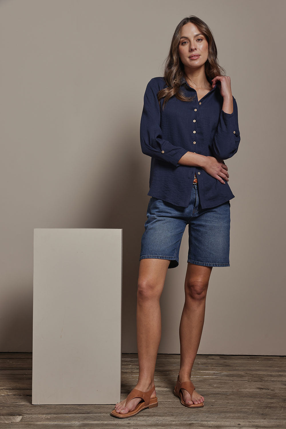 Model Madeline wearing size 10 of The Must Have Linen Look Shirt in colour Navy (Blue), from the front, showing the whole outfit