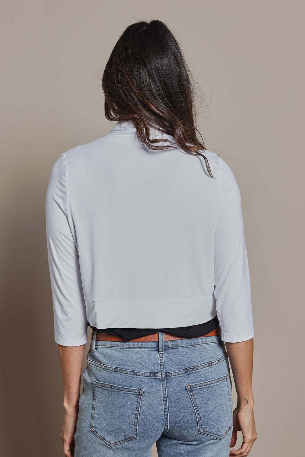 Model Amanda wearing size 10 of The Mix Me Match Me Bamboo Shrug in colour White (White), from the back