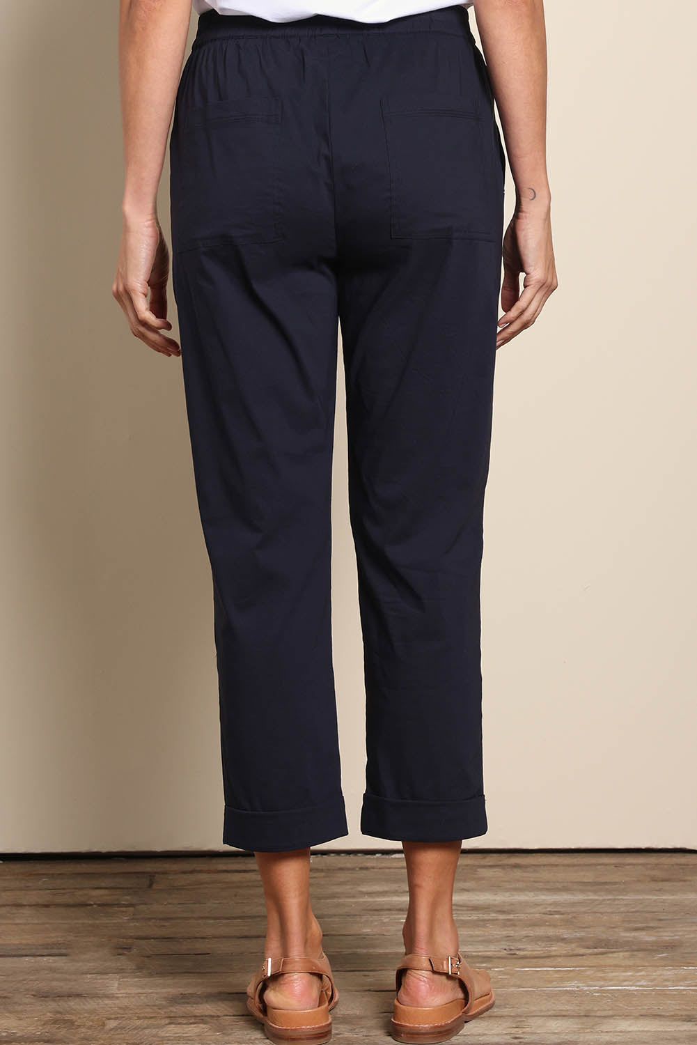 Model Amandam wearing size 10 of the The Elastic Waist Pull On Patch Pocket Pant – Navy in colour Navy, from the back