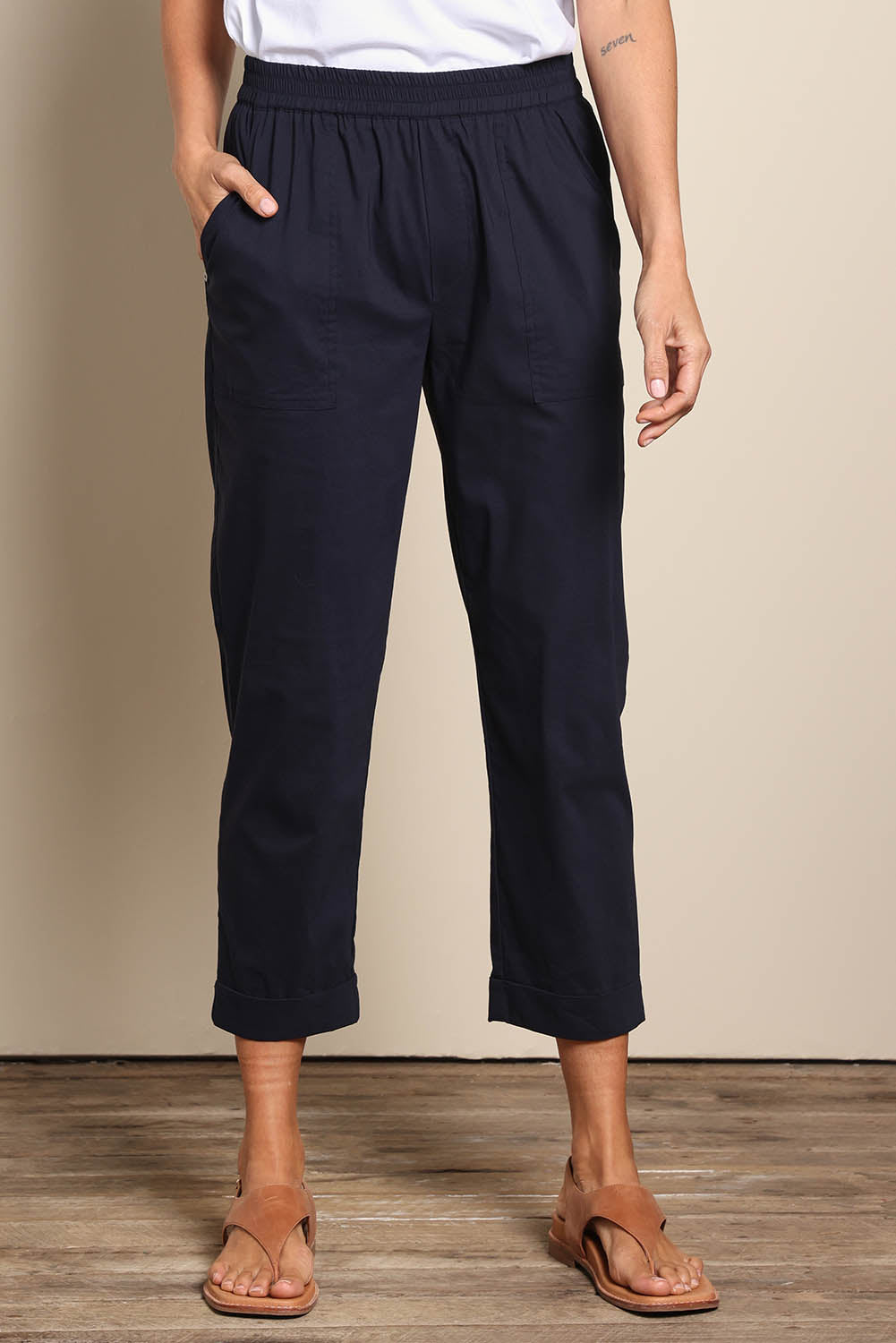 Model Amandam wearing size 10 of the The Elastic Waist Pull On Patch Pocket Pant – Navy in colour Navy, in a cropped view