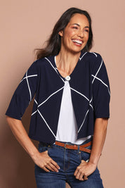 Model Amanda wearing size 10 of The Easy Wear Printed Shrug in colour Navywhite (Blue), from the front, cropped image