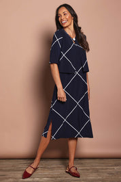 Model Amanda wearing size 10 of The Easy Wear Printed Shrug in colour Navywhite (Blue), from the front, showing the whole outfit