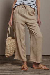 Model Madeline wearing size 10 of The Must Have Linen Look Pull on Pant in colour Biscotti, from the front, cropped image