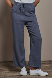 Model Madeline wearing size 10 of The Must Have Linen Look Pull on Pant in colour Denim (Blue), from the front, cropped image
