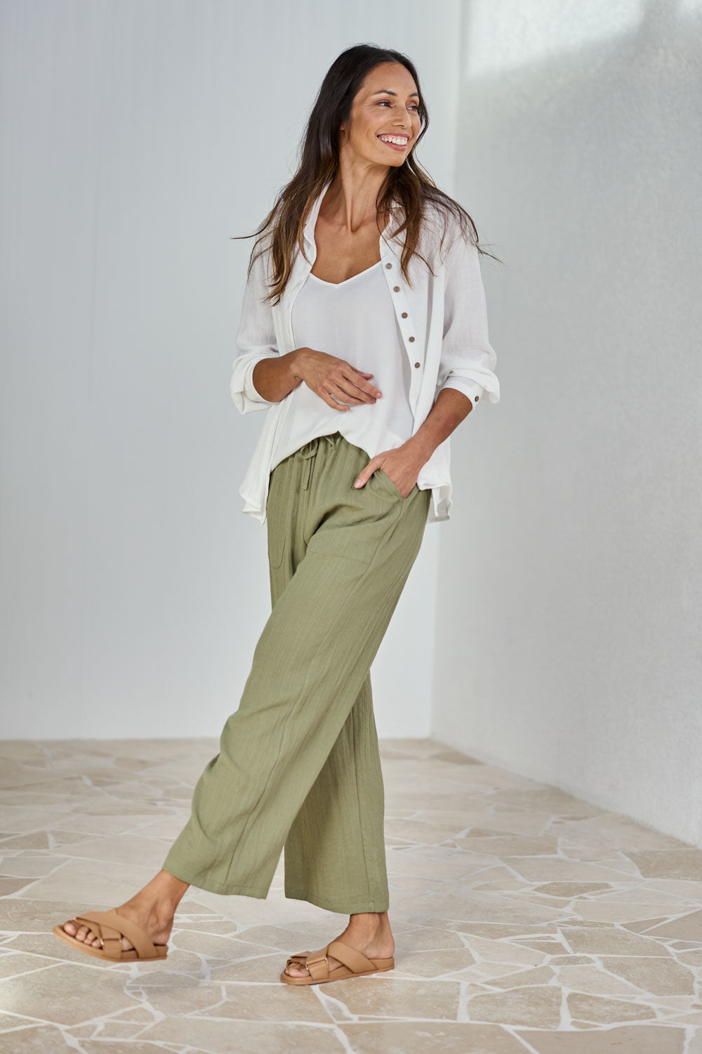Model Amanda wearing size 10 of The Must Have Linen Look Pull on Pant in colour Kkahi (Green), from the front, showing the whole outfit