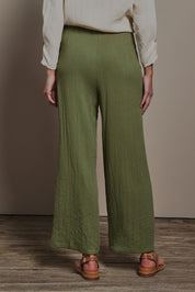 Model Madeline wearing size 10 of The Must Have Linen Look Pull on Pant in colour Kkahi (Green), from the back