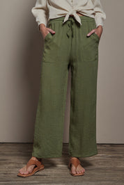 Model Madeline wearing size 10 of The Must Have Linen Look Pull on Pant in colour Kkahi (Green), from the front, cropped image