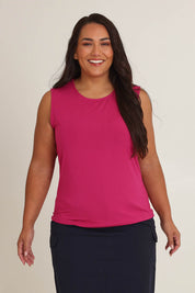Model Ashleigh wearing size 16 of The Mix Me Match Me Bamboo Tank in colour Cerise (Pink), from the front, cropped image