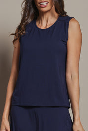 Model Amanda wearing size 10 of The Mix Me Match Me Bamboo Tank in colour Darknavy (Blue), from the front, cropped image