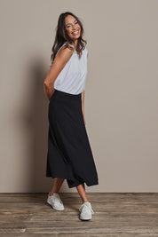 Model Amanda wearing size 10 of The Mix Me Match Me Bamboo Tank in colour White (White), from the front, showing the whole outfit
