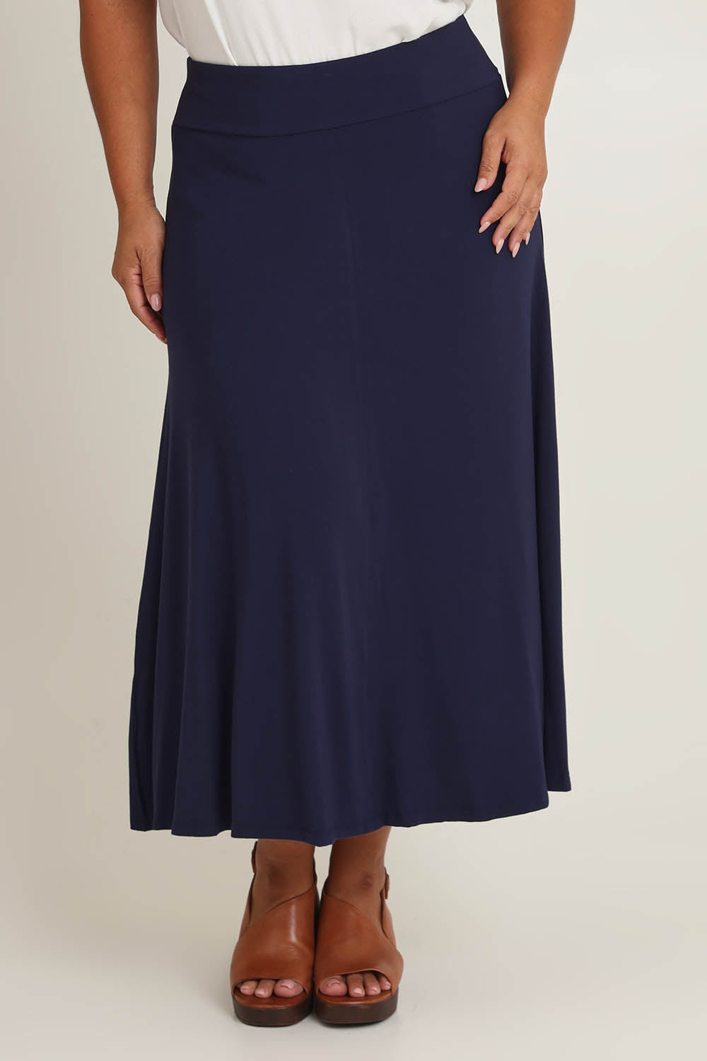 Model Ashleigh wearing size 16 of The Mix Me Match Me Bamboo Full Skirt in colour Darknavy (Blue), from the front, cropped image