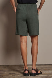 Model Amanda wearing size 10 of The Must Have Linen Look Pull On Shorts in colour Armygreen (Green), from the back