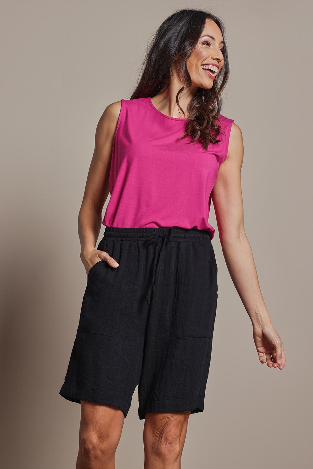 Model Amanda wearing size 10 of The Must Have Linen Look Pull On Shorts in colour Black (Black), from the front, cropped image