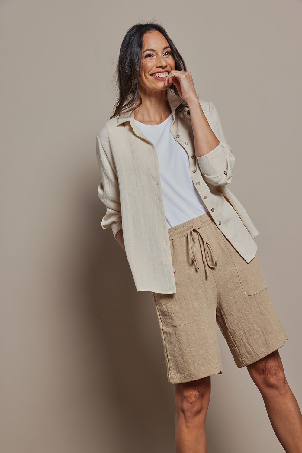 Model Amanda wearing size 10 of The Must Have Linen Look Pull On Shorts in colour Naturals, from the front, cropped image