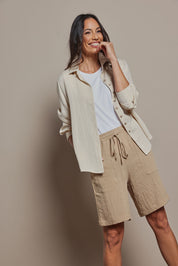 Model Amanda wearing size 10 of The Must Have Linen Look Pull On Shorts in colour Naturals, from the front, cropped image