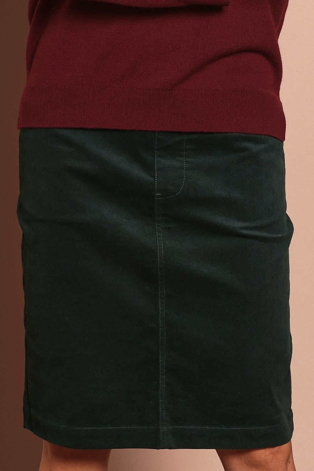 Model Amanda wearing size 10 of The Keepers Cord Pull On Skirt in colour Deepforest (Green), from the front, cropped image