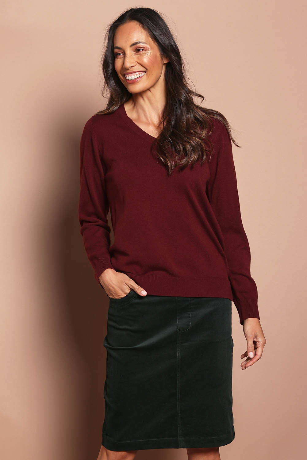 Model Amanda wearing size 10 of The Keepers Cord Pull On Skirt in colour Deepforest (Green), from the front, cropped image