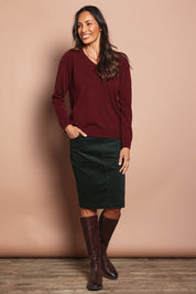 Model Amanda wearing size 10 of The Keepers Cord Pull On Skirt in colour Deepforest (Green), from the front, showing the whole outfit