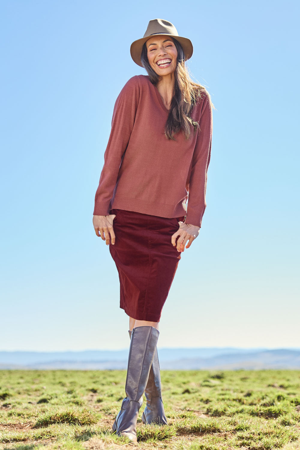 Model Amanda wearing size 10 of The Keepers Cord Pull On Skirt in colour Nutmeg, from the front, showing the whole outfit