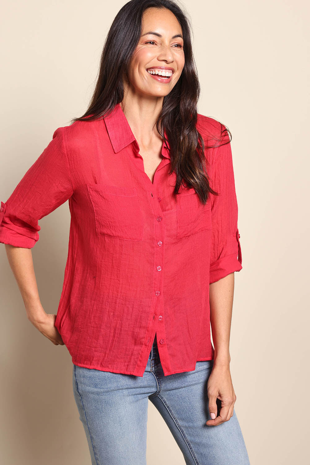 Model Amandam wearing size 10 of the The Go To Comfort Shirt - Raspberry in colour Raspberry, from an angle