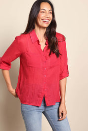 Model Amandam wearing size 10 of the The Go To Comfort Shirt - Raspberry in colour Raspberry, from an angle