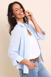 Model Amandam wearing size 10 of the The Easy Wear Shirt  - Chambray in colour Chambray, from an angle