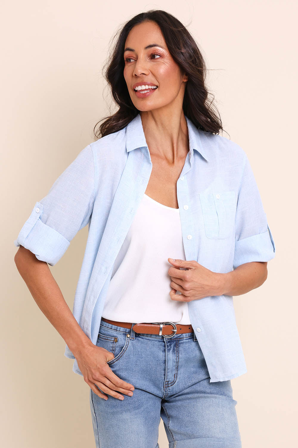 Model Amandam wearing size 10 of the The Easy Wear Shirt  - Chambray in colour Chambray, from an angle