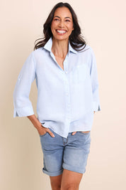 Model Amandam wearing size 10 of the The Easy Wear Shirt  - Chambray in colour Chambray, in a cropped view