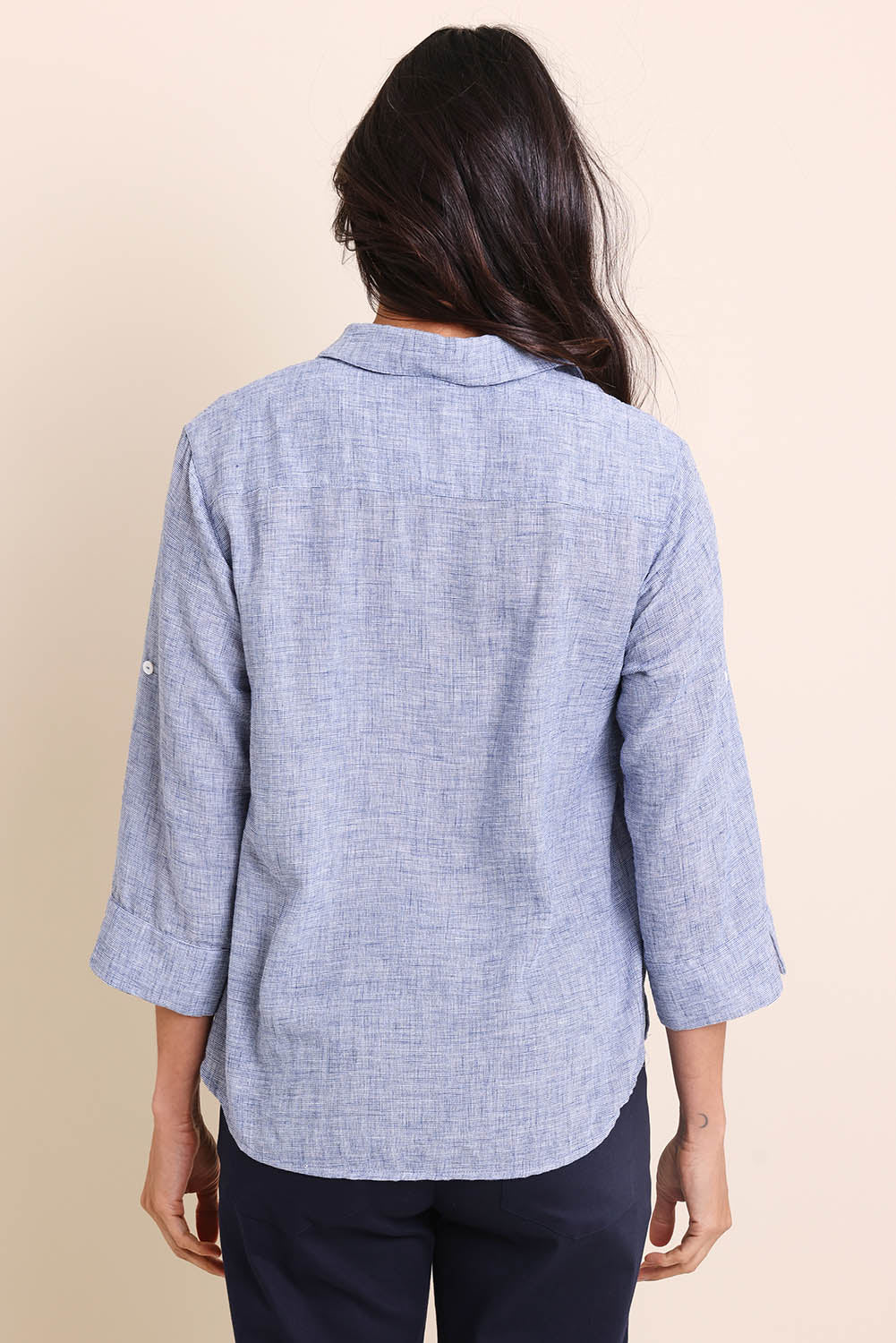 Model Amandam wearing size 10 of the The Easy Wear Shirt  - Navy in colour Navy, from the back