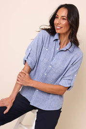 Model Amandam wearing size 10 of the The Easy Wear Shirt  - Navy in colour Navy, in a cropped view