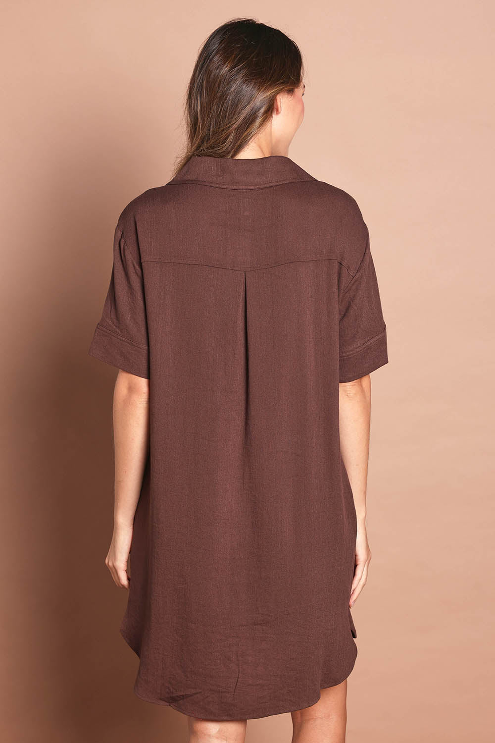 Model Madeline wearing size 10 of The Must Have Linen Look Shacket Dress in colour Chocolate, from the back