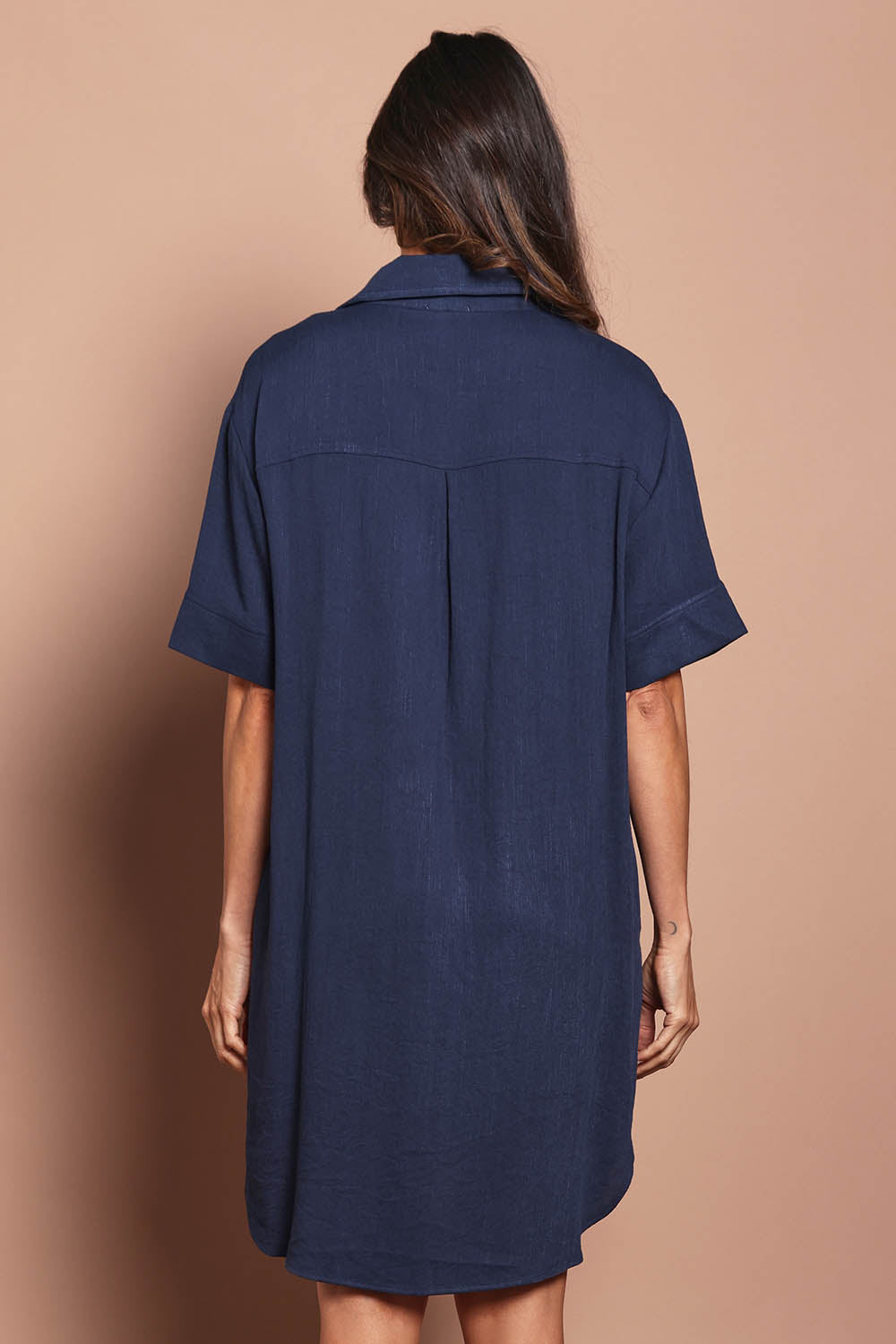 Model Amanda wearing size 10 of The Must Have Linen Look Shacket Dress in colour Navy (Blue), from the back