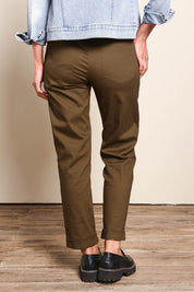 Model Riinar wearing size 10 of the The Teachers Cotton Pant With Pockets – Coffee in colour Coffee, from the back