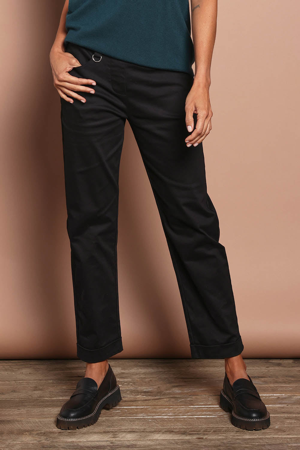 Model Amanda wearing size 10 of The Teachers Pant With Pockets in colour Honorblack (Black), from the front, cropped image