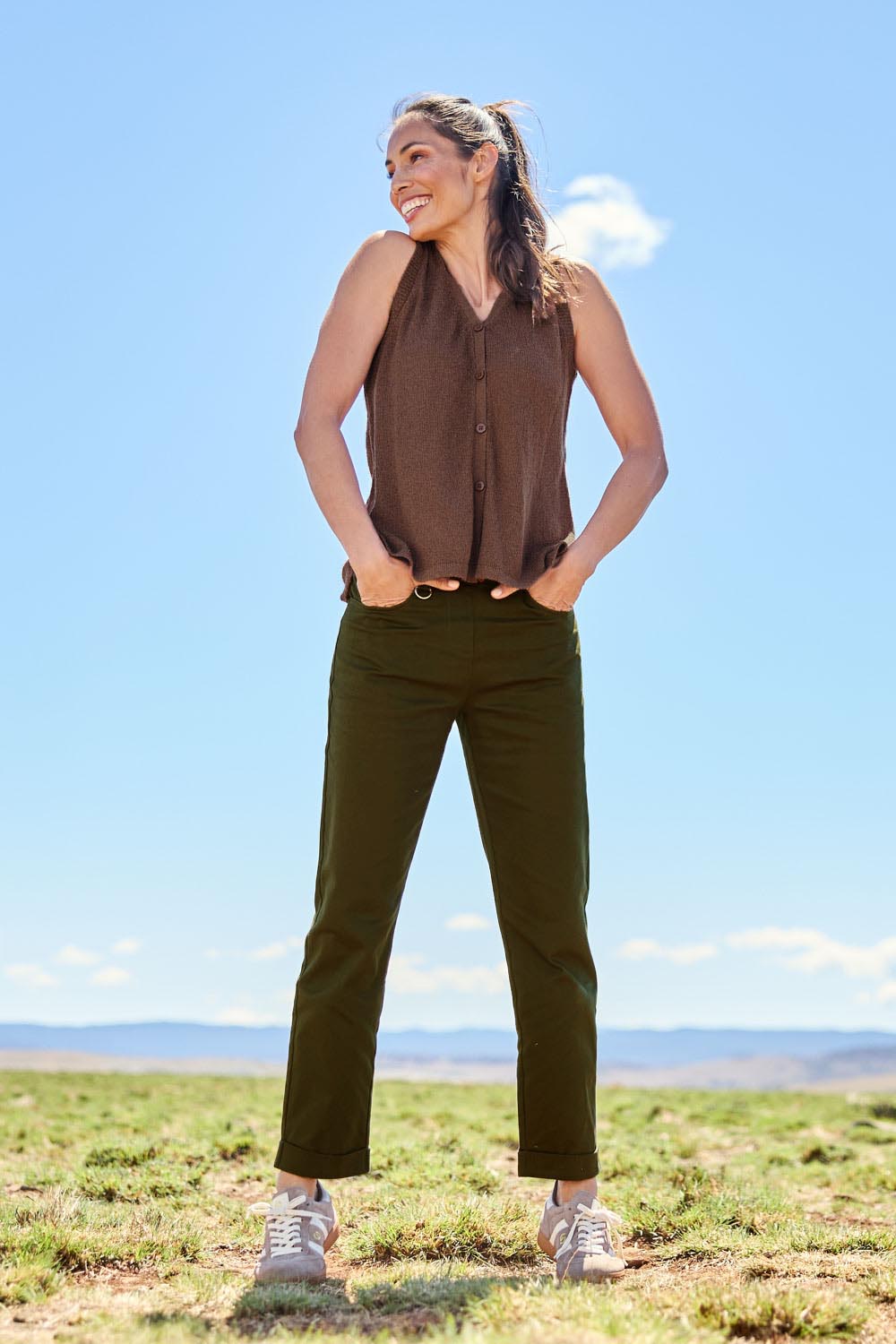 Model Amanda wearing size 10 of The Teachers Cotton Pant With Pockets in colour Pinegrove (Green), from the front, showing the whole outfit