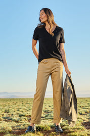 Model Amanda wearing size 10 of The Teachers Cotton Pant With Pockets in colour Sandstone, from the front, showing the whole outfit