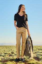 Model Amanda wearing size 10 of The Teachers Cotton Pant With Pockets in colour Sandstone, from the front, showing the whole outfit