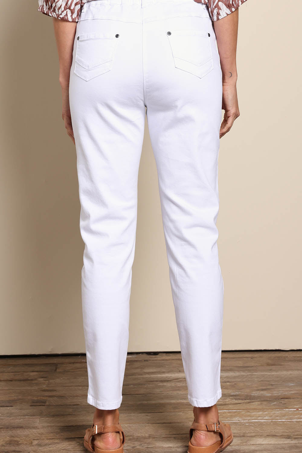 Model Amandam wearing size 10 of the The Cotton Pull On Stretch Comfort Pant – White in colour White, from the front