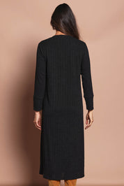 Model Amanda wearing size 10 of The Easy Wear Knit Dress in colour Black (Black), from the back