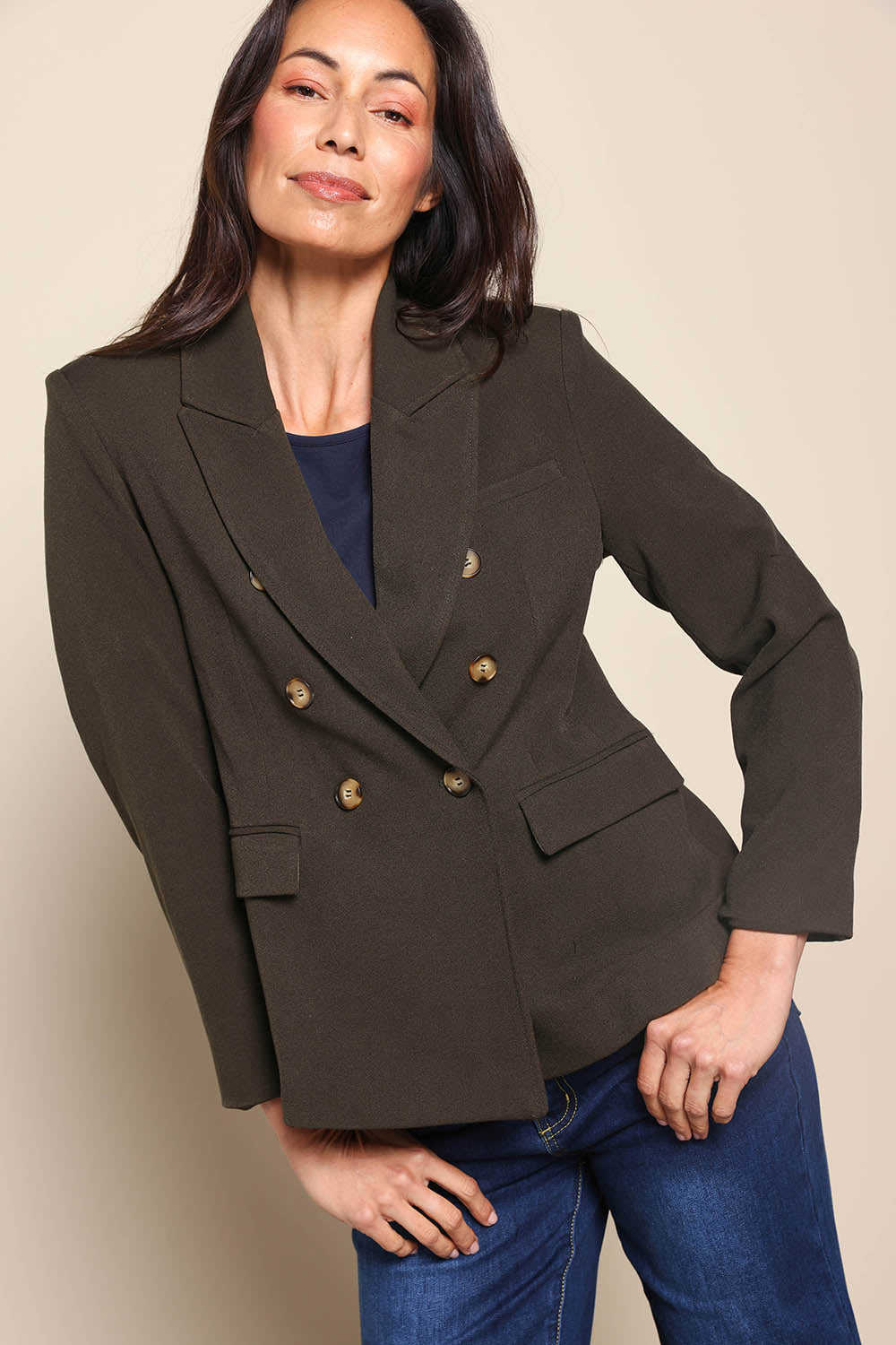 Model Amandam wearing size 10 of the The Classic Double Breasted Blazer – Olive in colour Olive, from an angle