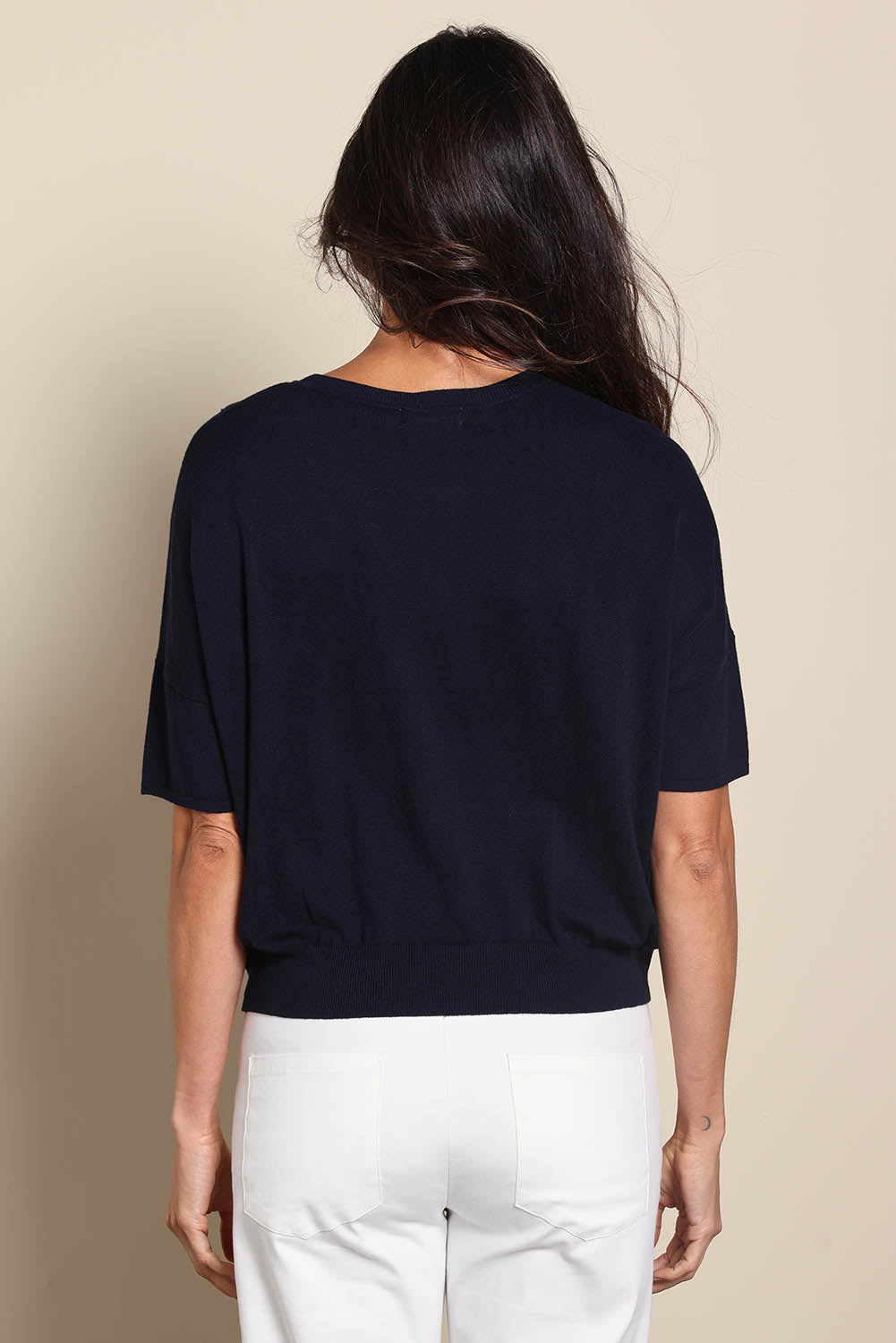 Model Amandam wearing size 10 of the The Essential Knit Tee – Darklapis in colour Darklapis, from the back