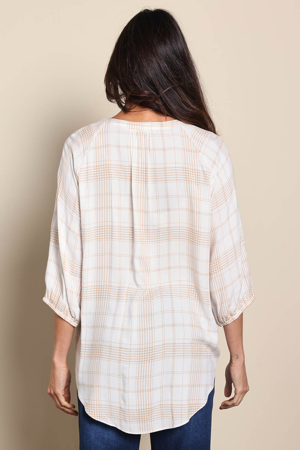 Model Amandam wearing size 10 of the The Every Wear Shirt – Ivorysand in colour Ivorysand, from the back