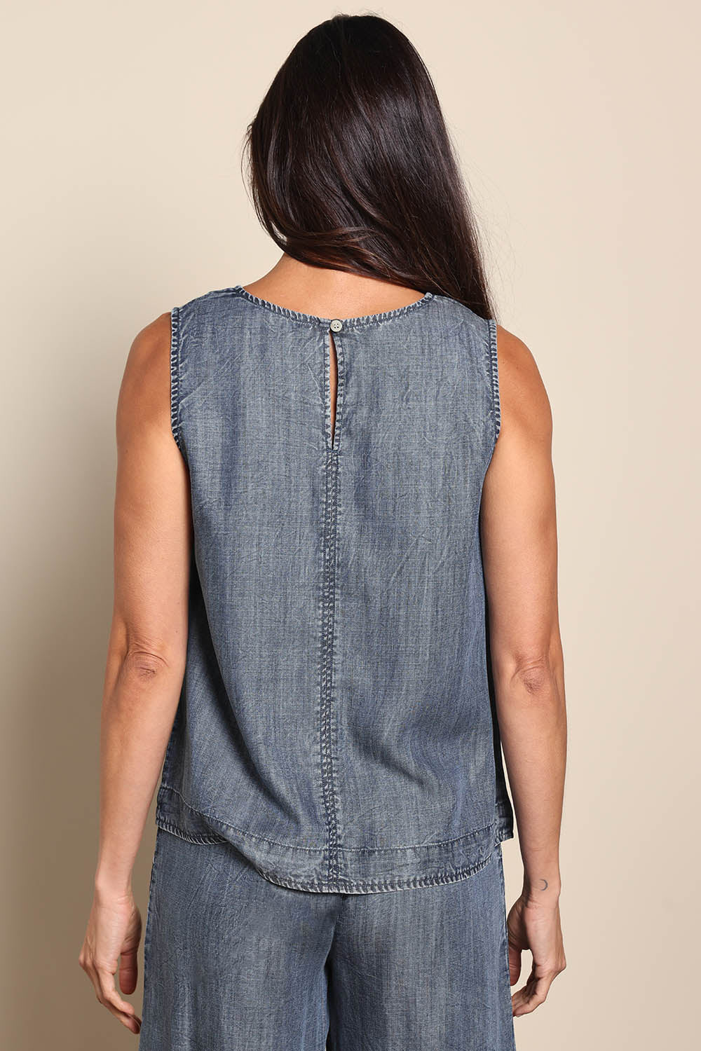 Model Amandam wearing size 10 of the The Luxe Lyocell Tank – Indigo in colour Indigo, from the back
