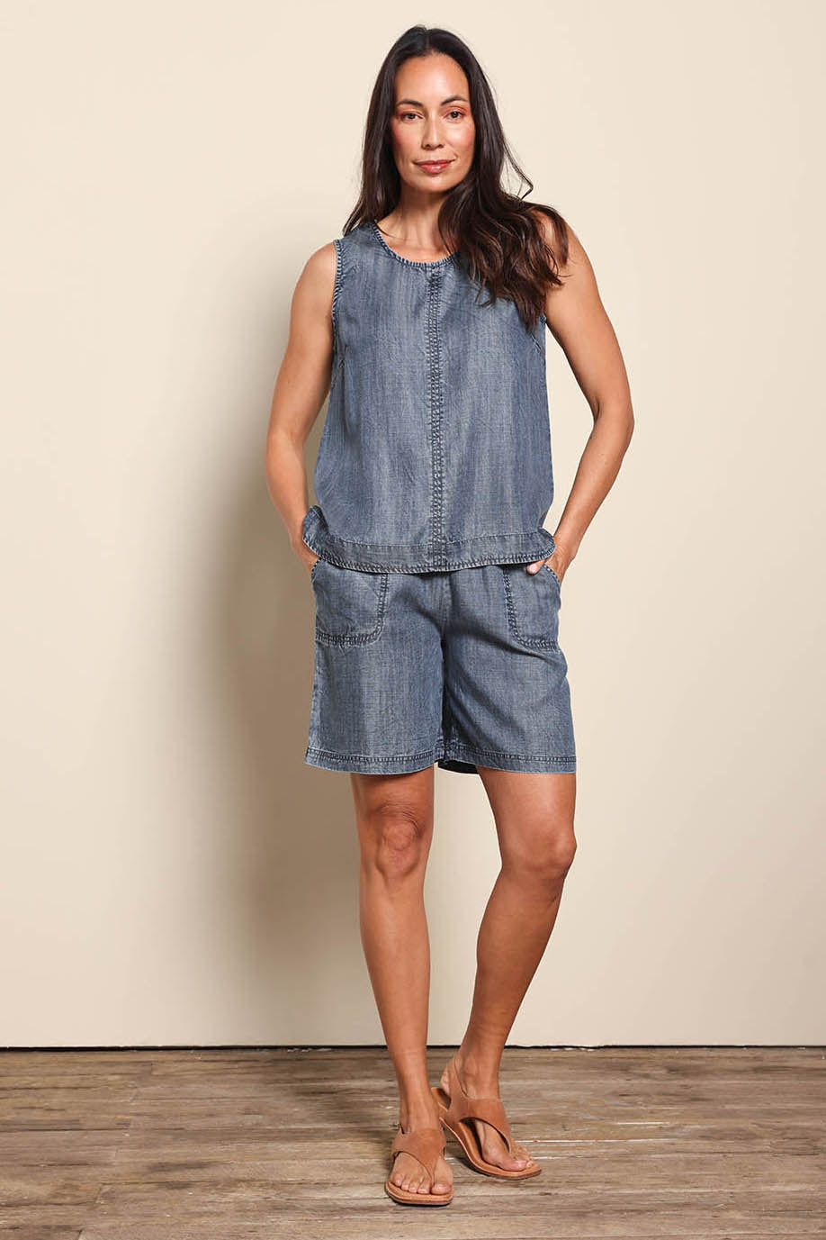 Model Amandam wearing size 10 of the The Luxe Lyocell Tank – Indigo in colour Indigo, from the front