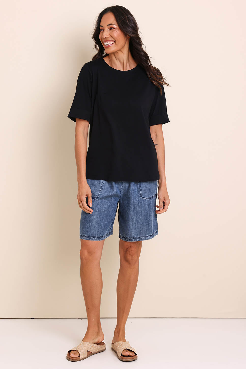 Model Amandam wearing size 10 of the The Keepers Relaxed Fit Tee – Black in colour Black, from the front