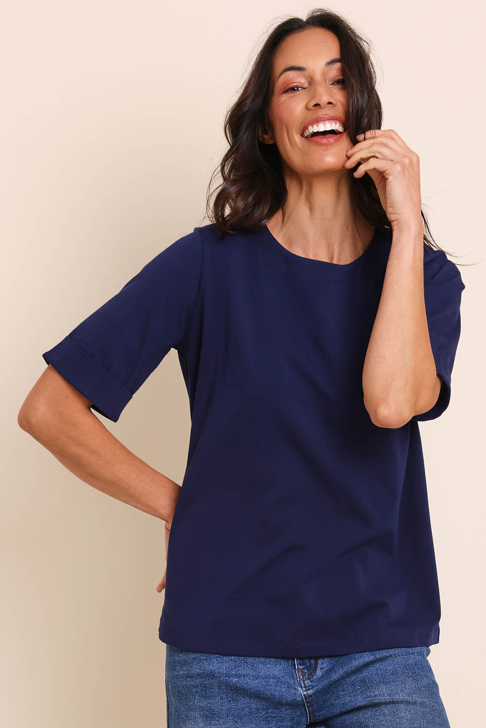 Model Amandam wearing size 10 of the The Keepers Relaxed Fit Tee – Navy in colour Navy, from an angle